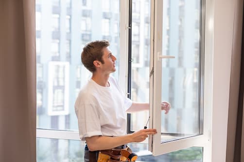 a-repairman-fixing-windows-in-new-apartment-2025-01-10-02-23-53-utc.jpg
