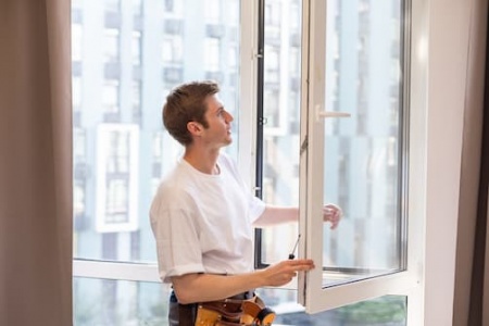 a-repairman-fixing-windows-in-new-apartment-2025-01-10-02-23-53-utc.jpg